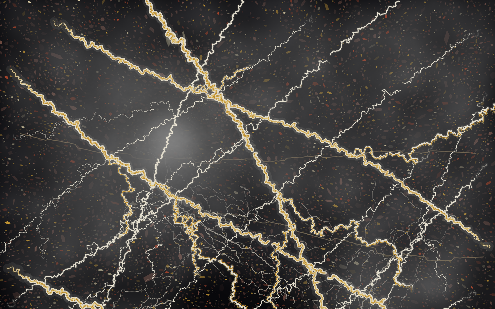 The pristine marble master in daylight: a married gold-and-white fracture network over near-black granite, dense with speck and fog detail.